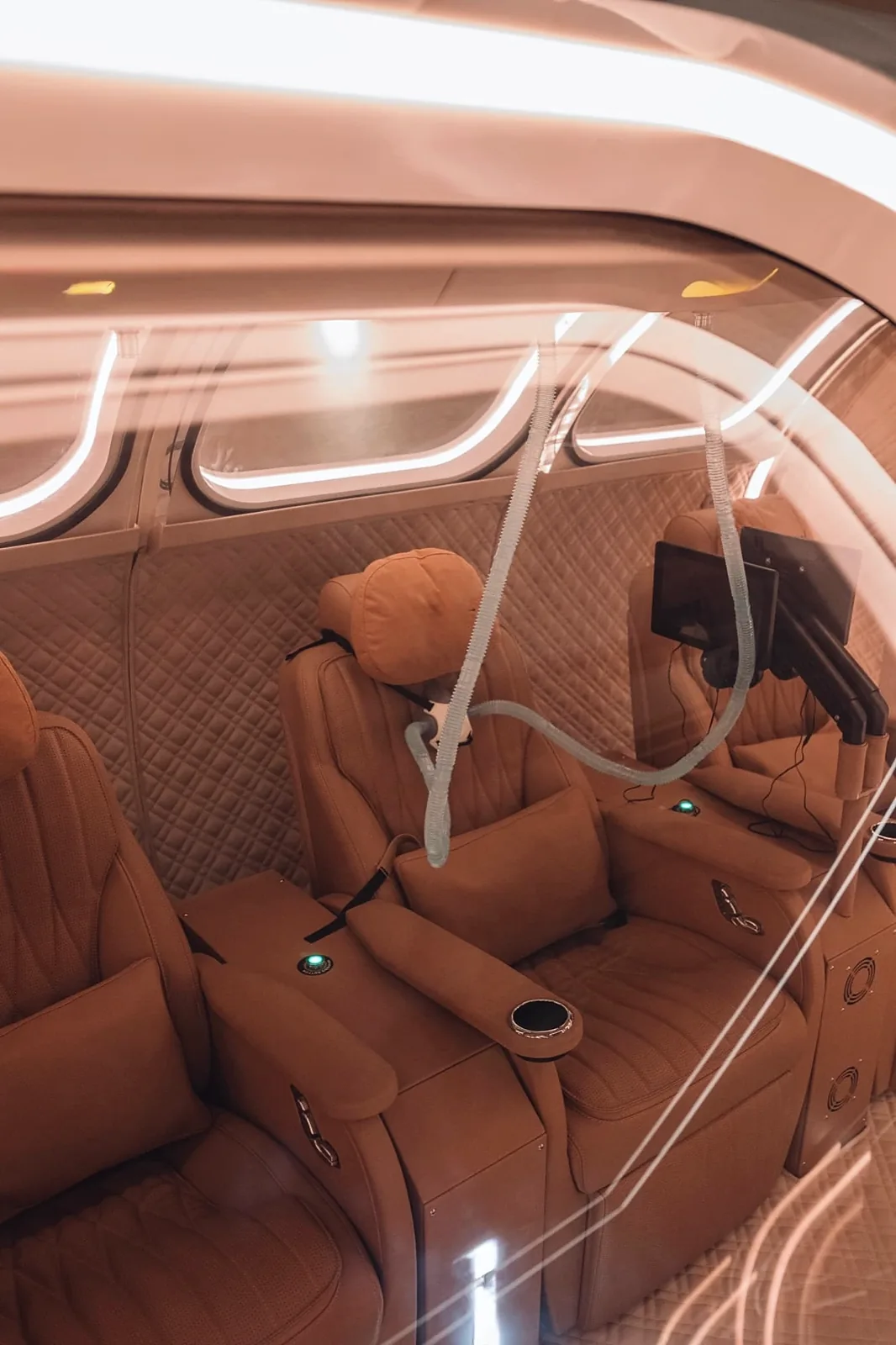 Leather seats with individual oxygen masks inside the chamber