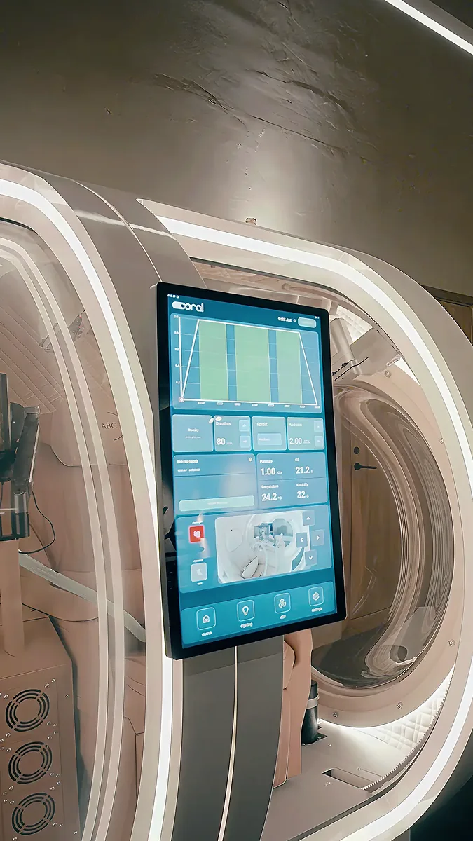 Touchscreen control panel on the chamber showing live pressure and temperature readings