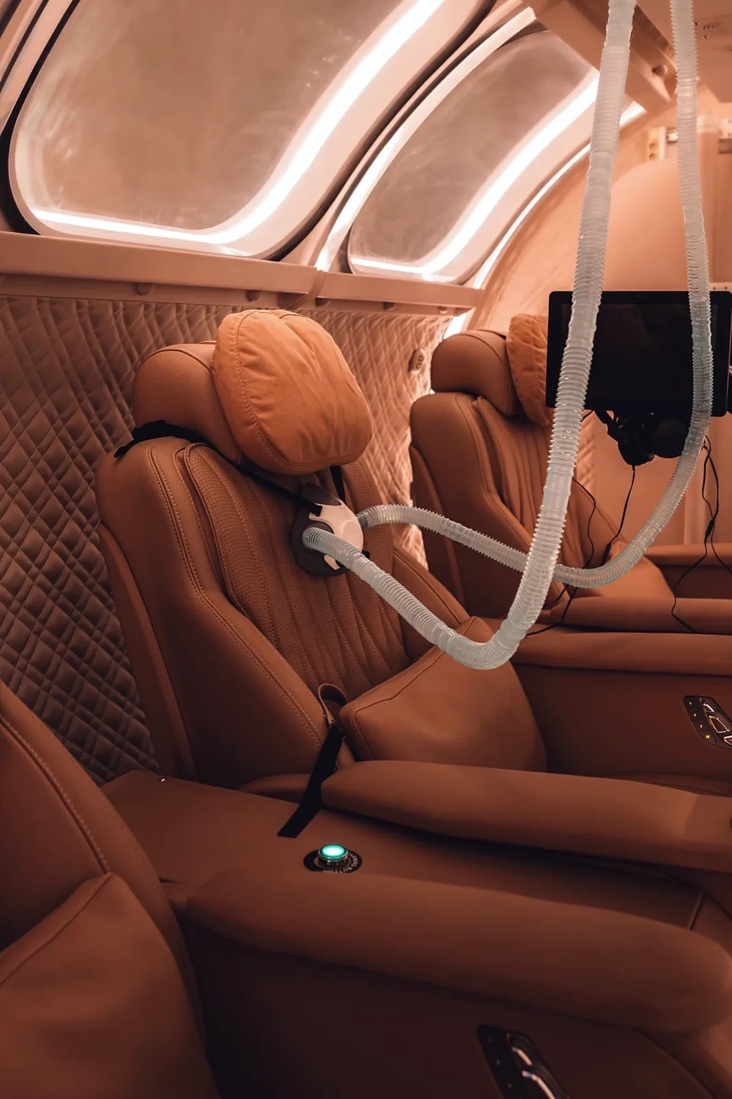 First-class leather seats with individual oxygen masks inside the chamber