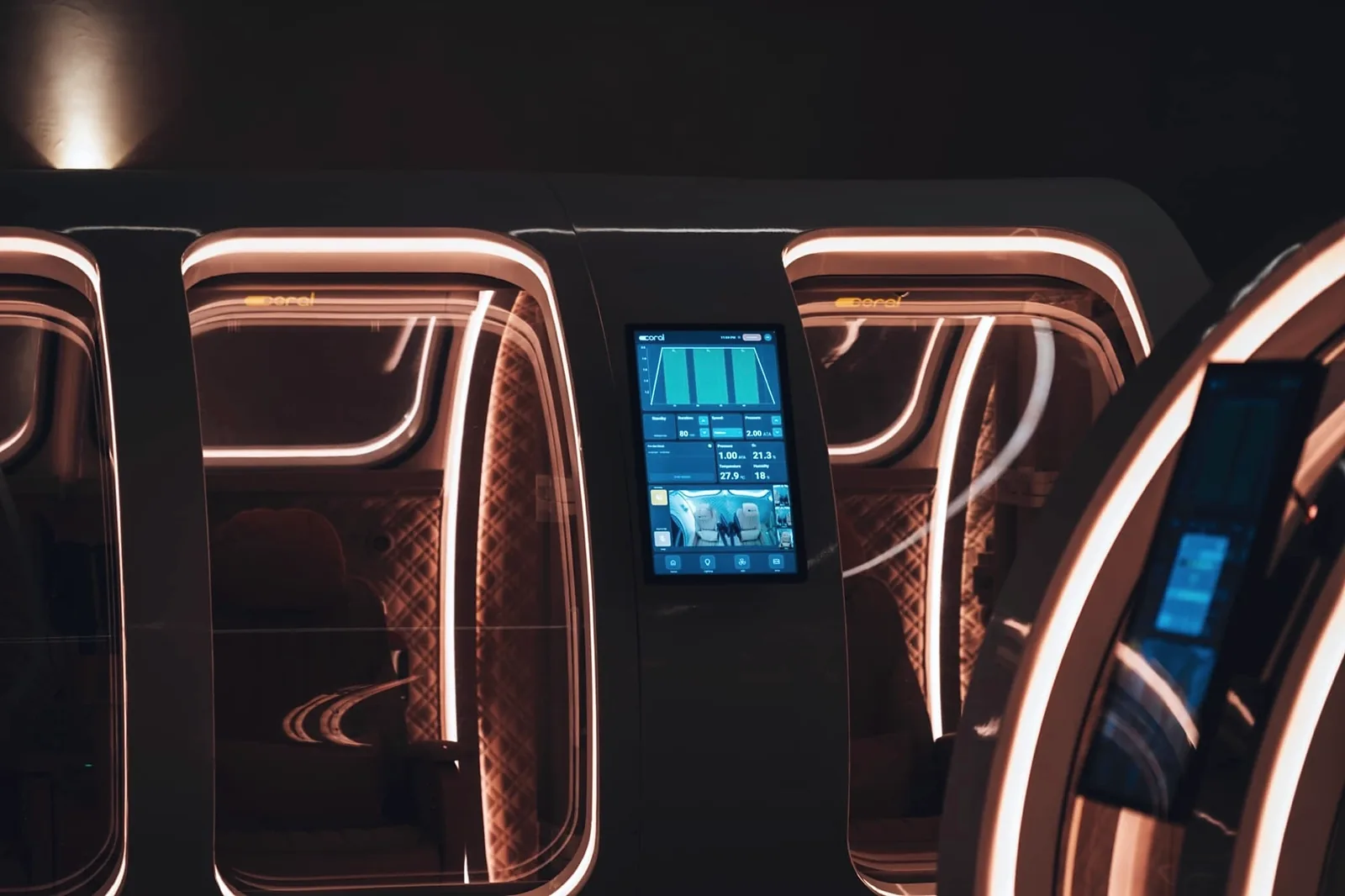 Three illuminated hyperbaric chambers with live monitoring displays